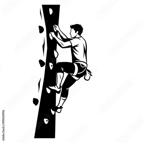 A silhouette of a man rock climbing on an artificial wall