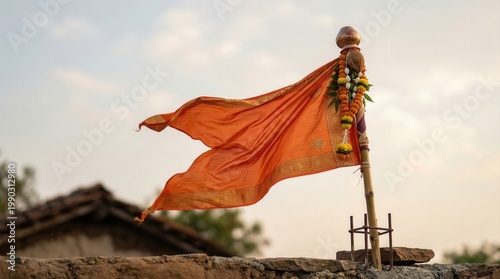Gudi symbol positioned on outdoor street scene in mid view. Representation of Hindu New Year celebration and cultural identity.