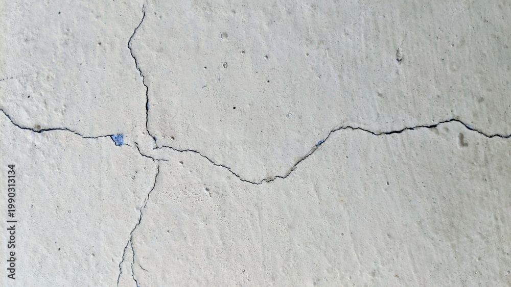 Αυτοκόλλητο A high-resolution texture of a weathered white wall showing fine hairline cracks and rustic aging
