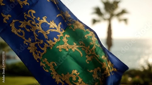 Elegant banner with golden scrollwork gracefully waving against a tropical sunset backdrop, evoking luxury and serene beauty on a breezy evening