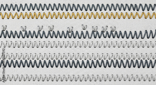 Close up of many metal springs in a row.