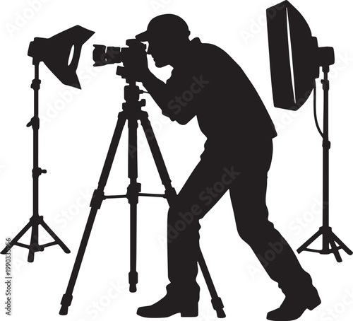 Silhouette of a photographer taking a picture with studio lighting