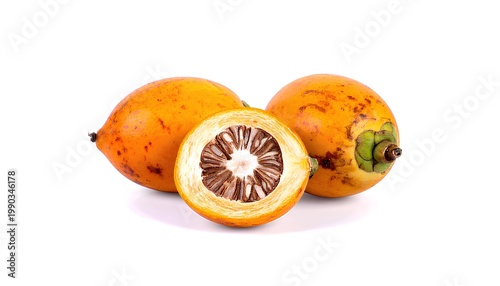 Fresh ripe areca nuts with a cross-section showing the inner seed.