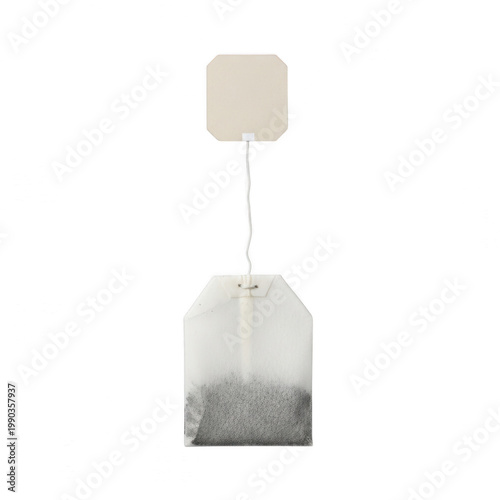 Steeped tea bag with string and tag on white background, perfect for beverage or food design