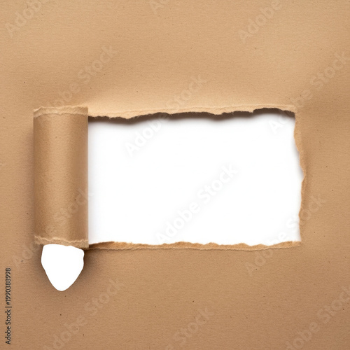 Torn brown kraft paper revealing white background, ripped cardboard hole with curled edges, textured paper frame for message or copy space
