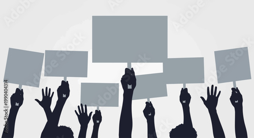 People holding up protest signs high.