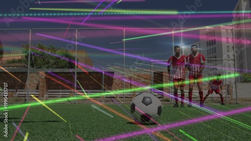 Kicker running and kicking ball seeking goal in sports freekick, wall reacting under neon veil