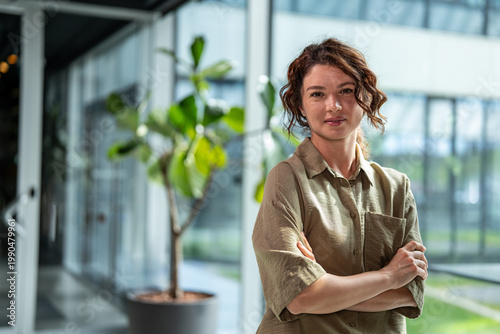 Obraz na plátně Businesswoman posing with confidence in modern office environment