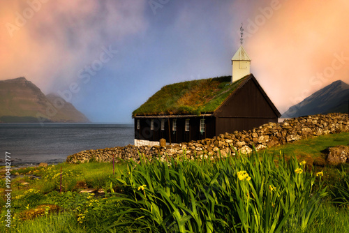Beautiful spring scenery. Sunny spring view of Saksun village with typical turf-top houses, Faroe Islands. Splendid scene of Streymoy island, Denmark, Europe