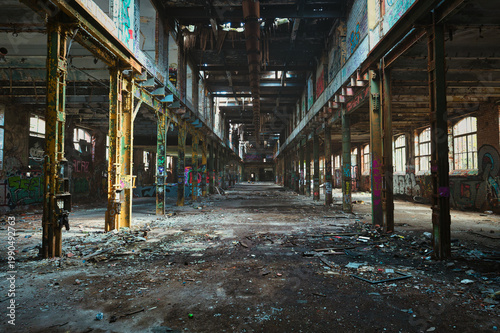 Abandoned Industrial Warehouse Hall with Graffiti Art, Vandalized Derelict Factory Interior in Post-Apocalyptic Style