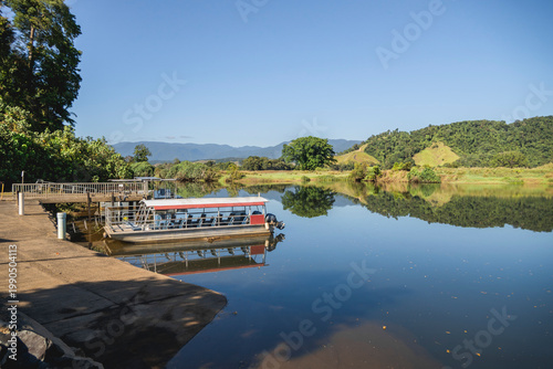 Fényképezés Daintree River, Daintree village, Far North Queensland, Australia, featuring a moored tour boat at a landing dock