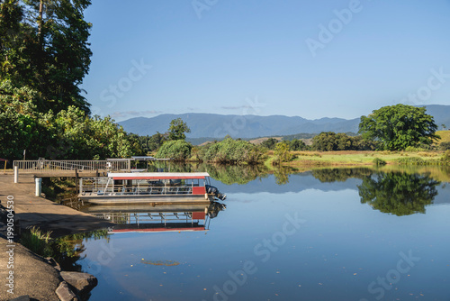 Tableau sur toile Daintree River, Daintree village, Far North Queensland, Australia, featuring a moored tour boat at a landing dock