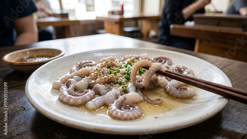 Sannakji from South Korea – live octopus tentacles sliced and served immediately, still moving on plate, with sesame oil.