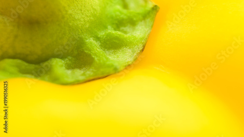 Fotografie Yellow bell pepper macro background