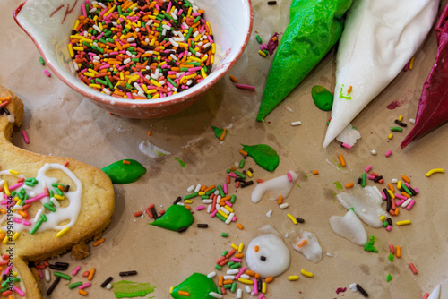 mess made from decorating cookies with sprinkles and icing