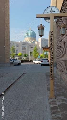 Street view in Tashkent with mosque blue dome and traditional lantern