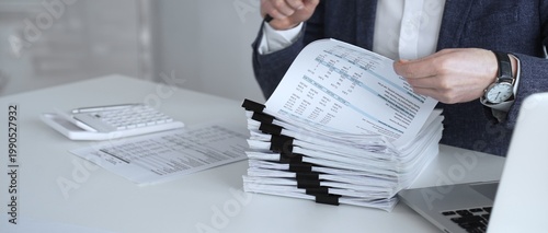 Εκτύπωση καμβά Auditor or accountant inspecting financial documents with a magnifying glass