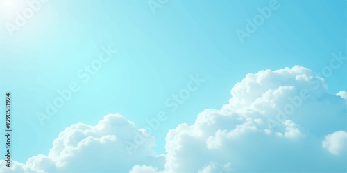 A beautiful clear blue sky filled with fluffy white cumulus clouds basking in bright summer sunlight for a peaceful nature cloudscape