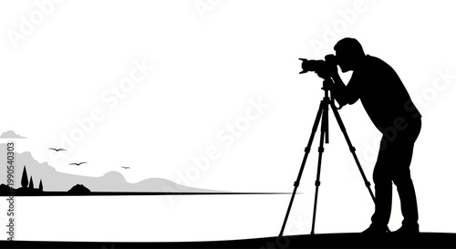 Silhouette of a photographer capturing a landscape scene.