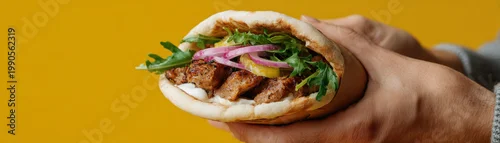 Panel kuchenny z motywem Gyros sandwich pita bread grilled meat hand held fast food, fresh street meal on yellow