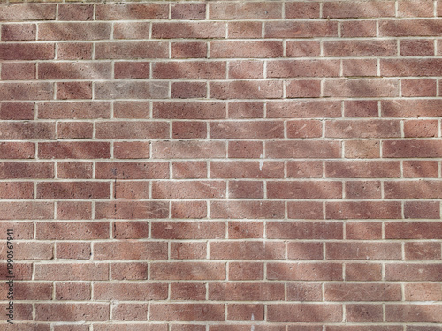Brick wall texture background with aged, grunge appearance. Architectural, urban or vintage design