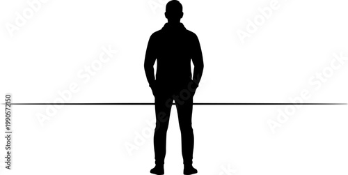 Silhouette of a man standing with hands in pockets, back view
