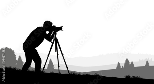 Silhouette of a photographer capturing a landscape scene.