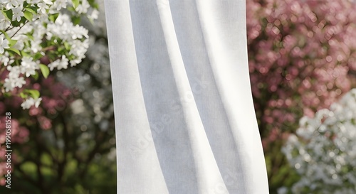 Soft White Curtain Draped in Front of Blooming Garden
