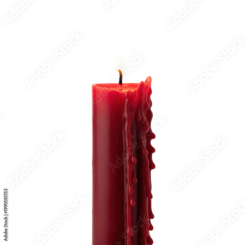 A tall crimson red pillar candle with intricate melting wax drips and a golden flickering flame in a minimalist white studio tranquil elegance concept