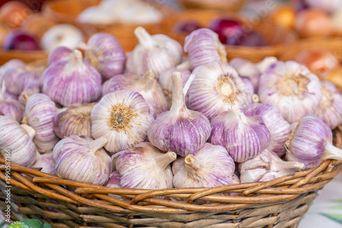 Garlic in a basket for sale at a market stall