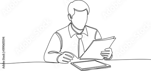 Businessman reading documents at desk 2.