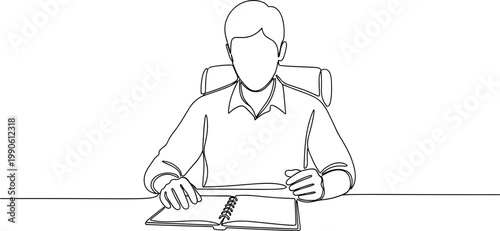 Man sitting at desk writing documents.