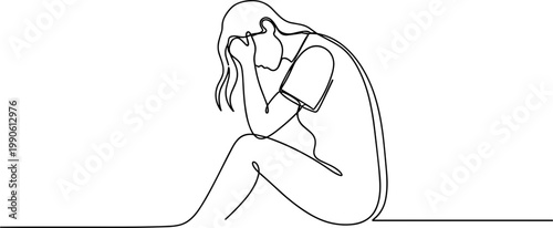 Sad woman sitting alone crying.
