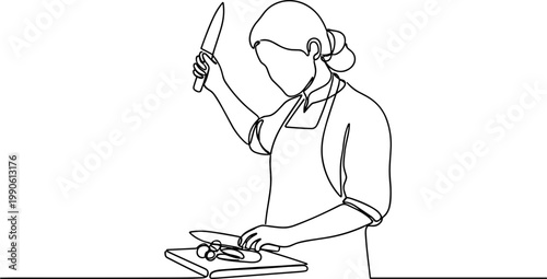 Woman cutting food on a board.