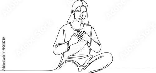 Woman sitting in yoga pose meditating 1.