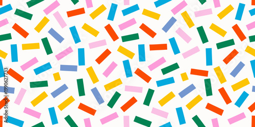 Colorful confetti pattern with scattered rectangular shapes against a white background