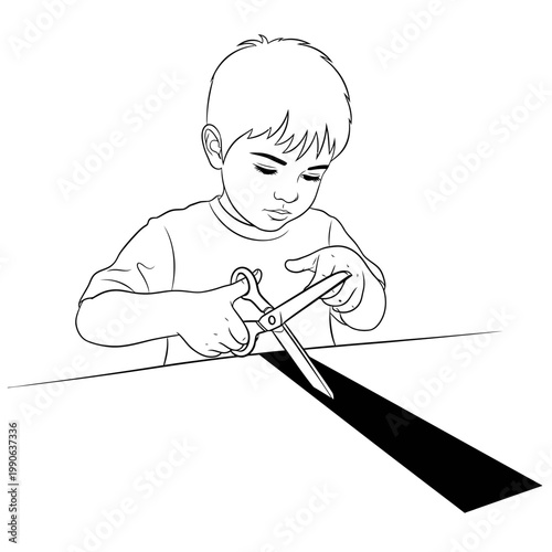 Boy cutting paper with scissors.