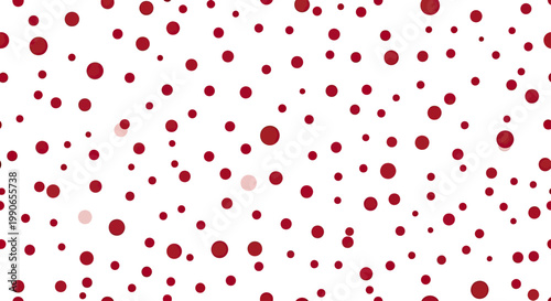 Scattered red and light pink circles of various sizes on a white background