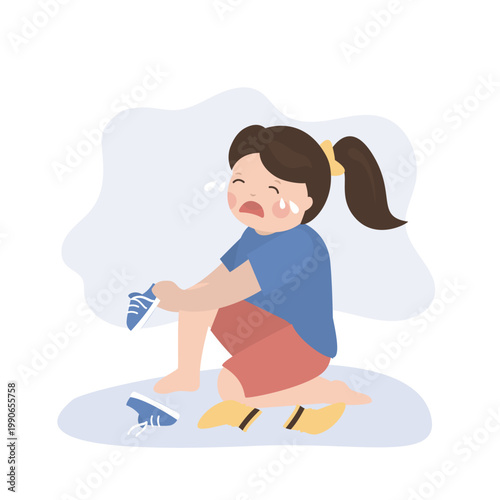 Small child cannot put on her own shoes. The girl cries because of problems putting on socks and shoes. Female preschooler is learning to put on sneakers.