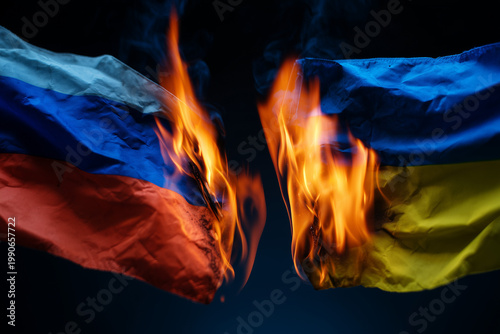 Burning Ukraine Russia flags