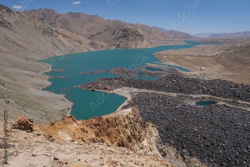 Canvastavla Scenery of Pamir Mountains with turquoise lake Yashilkul and silhouettes of trek