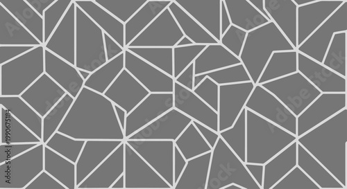 A seamless geometric pattern of irregular polygons against a gray background