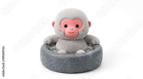 Cute plush monkey relaxing in stone bowl