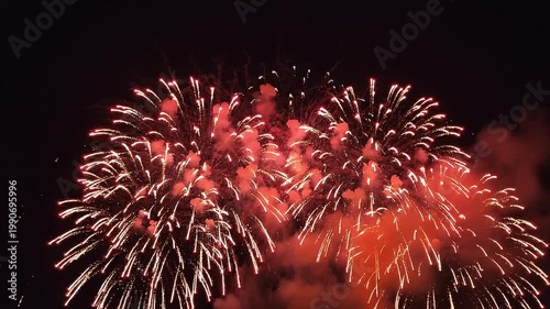 Cinematic red white and blue fireworks with large copy space for overlay, 8K realistic night sky celebration, 60fps HDR stock footage. 2026