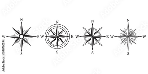 Set of four classic nautical compass rose icons in various styles for cartography and navigation themed design vector