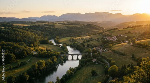 Aerial View of a Winding River and Stone Bridge at Sunset