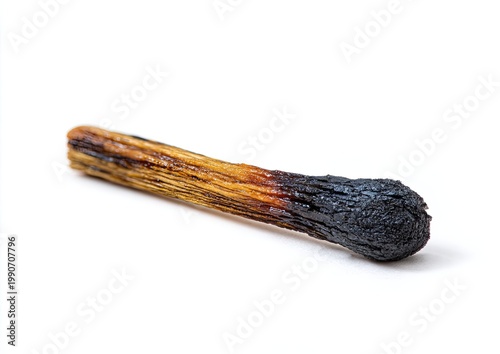 Single burnt matchstick with charred head, isolated on a white background