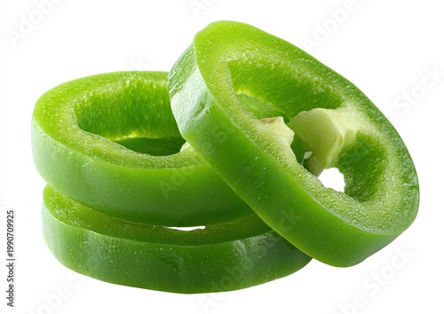 Stacked vibrant green pepper rings with visible seeds and flesh
