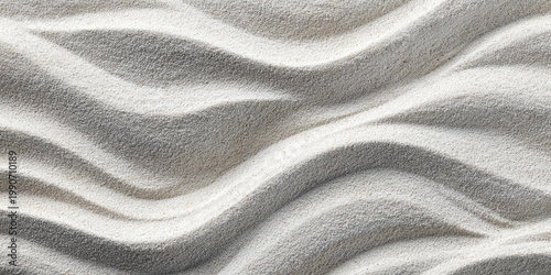 Close-up of white, rippled sand dunes with soft lighting and subtle shadows
