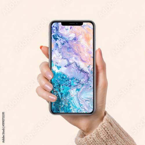 A hand holds a smartphone displaying vibrant, abstract swirling colors